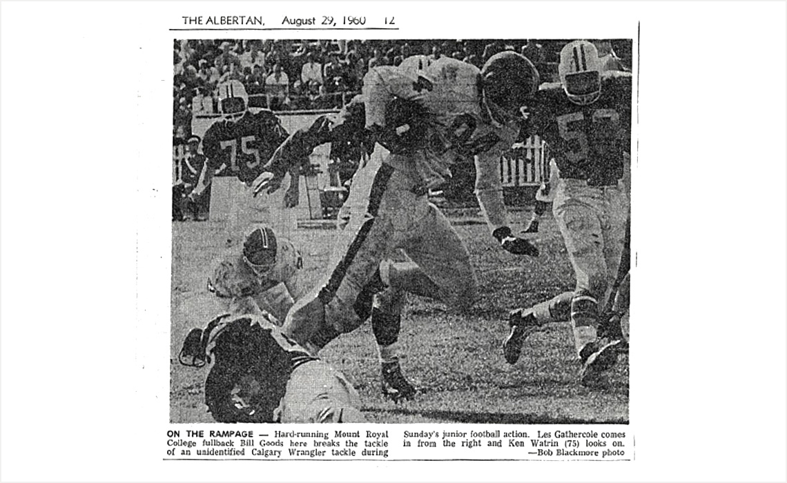 Clipping of the Aug. 29, 1960 issue of "The Albertan" showing a photo of fullback Bill Goods breaking the tackle of a player on the Calgary Wranglers.