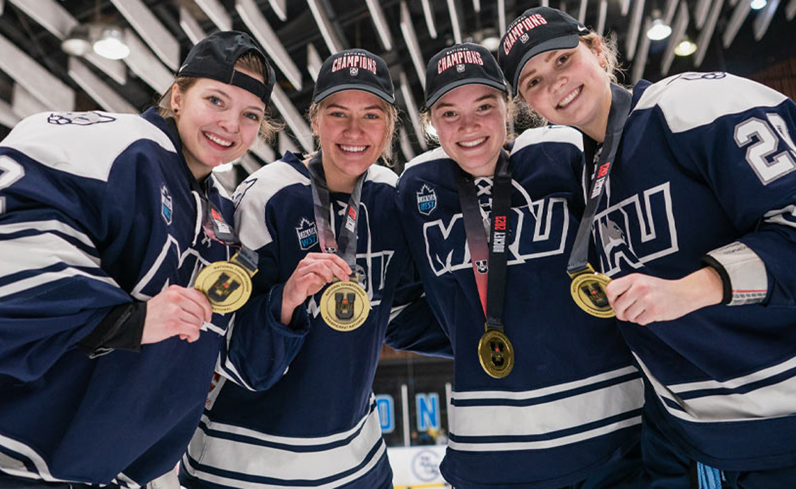 Kaitlyn Ross, Kiana McNinch, Ava Metzger and Athena Hauck celebrating their gold-medal win together