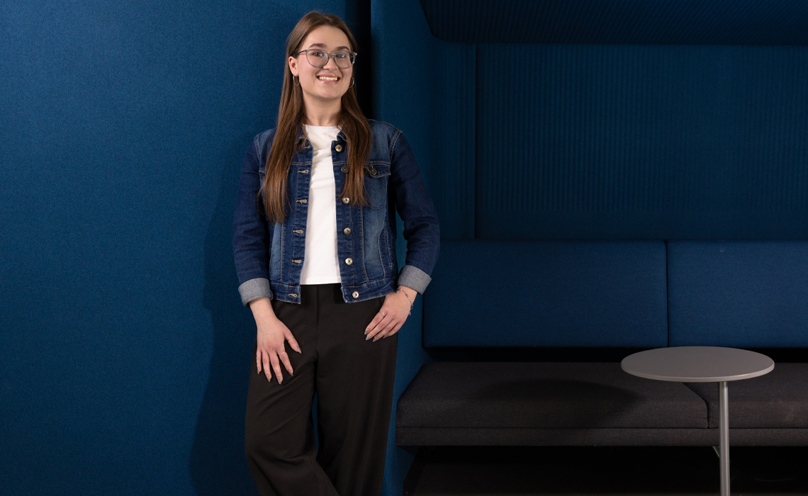Danaë Webb poses for a photo in the Riddell Library & Learning Centre.