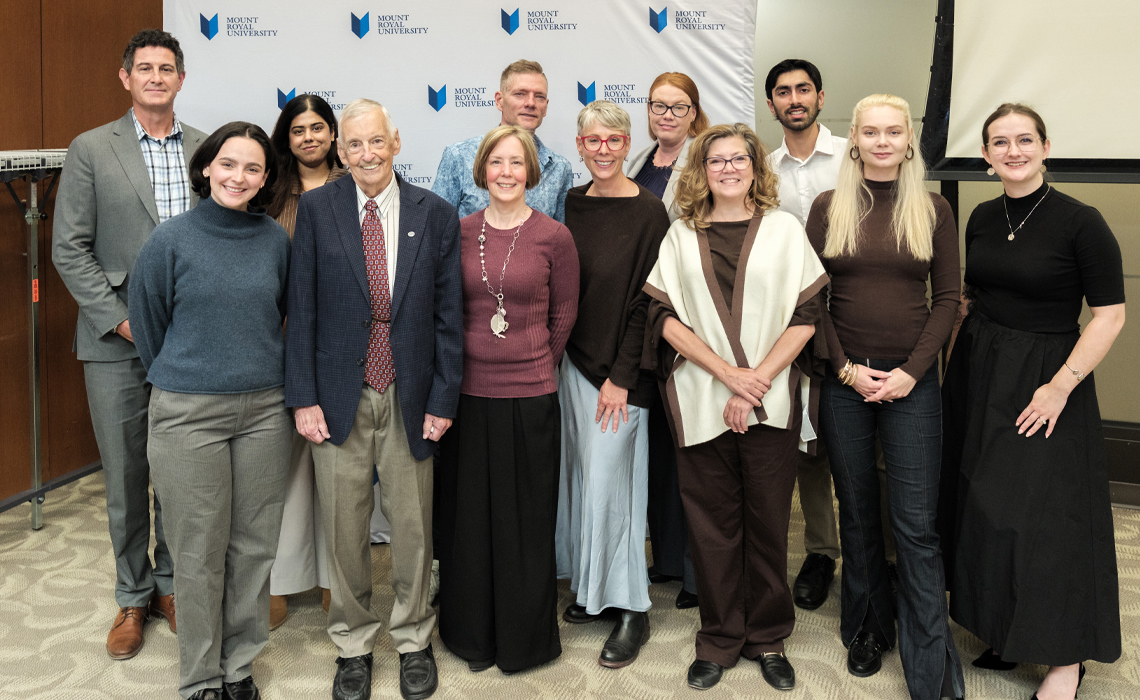 David Annesley and and his family with MRU students, faculty and CPRS members pose for a photo at MRU.