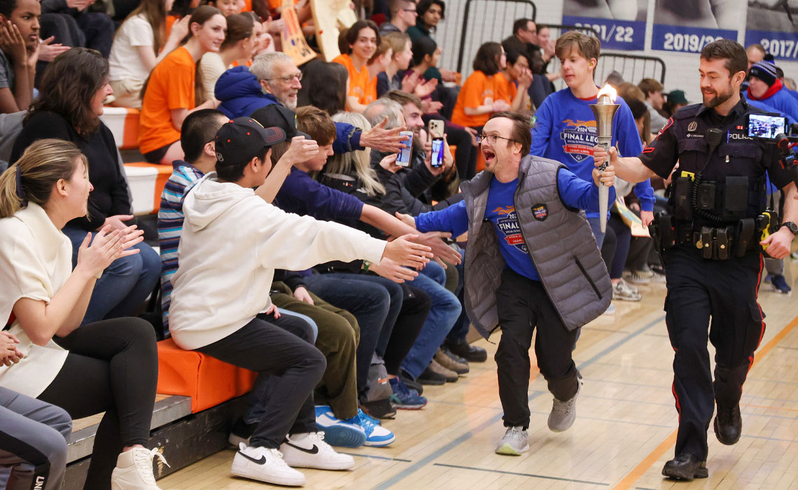 David Hall carries the torch for Special Olympics Canada Winter Games.