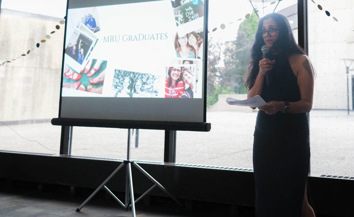 Deepa Upadhyaya delivers remarks at the celebration of midwifery graduates from the last decade.