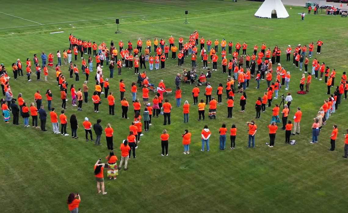 A drone captures the human spiderweb formed by students, staff and faculty.
