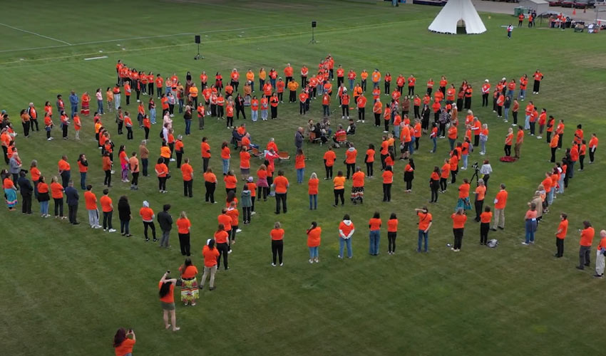 A drone captures the human spider web formed by students, staff and faculty.
