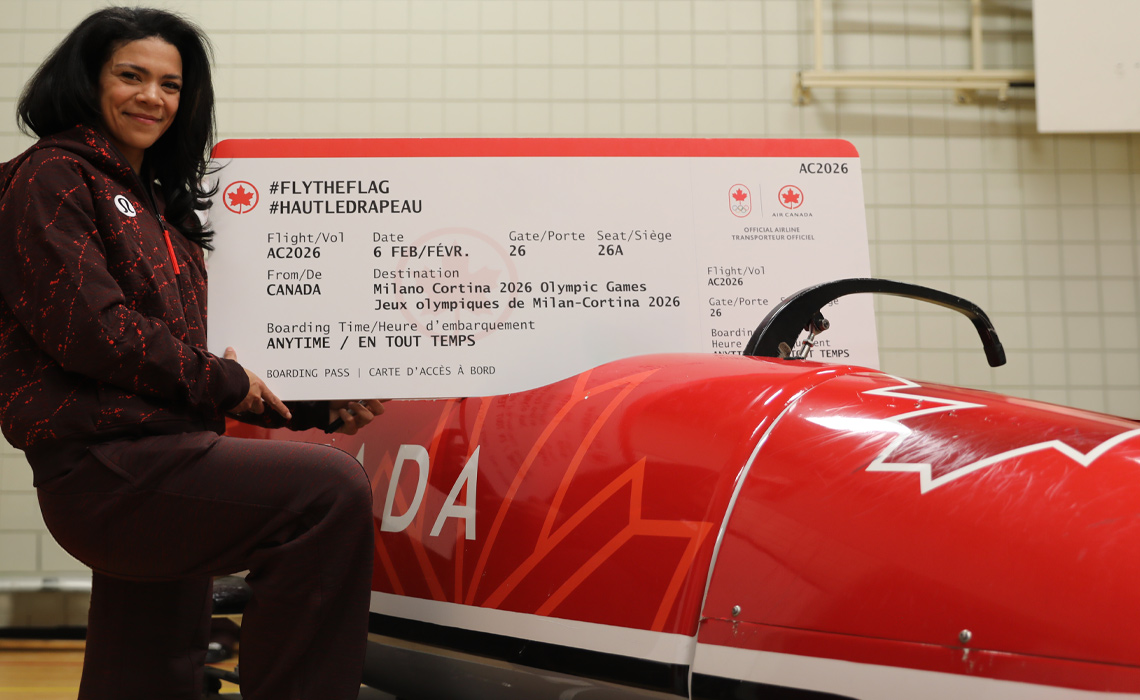 Eden Wilson holds her ceremonial Air Canada boarding pass for the Milano Cortina 2026 Winter Olympics.