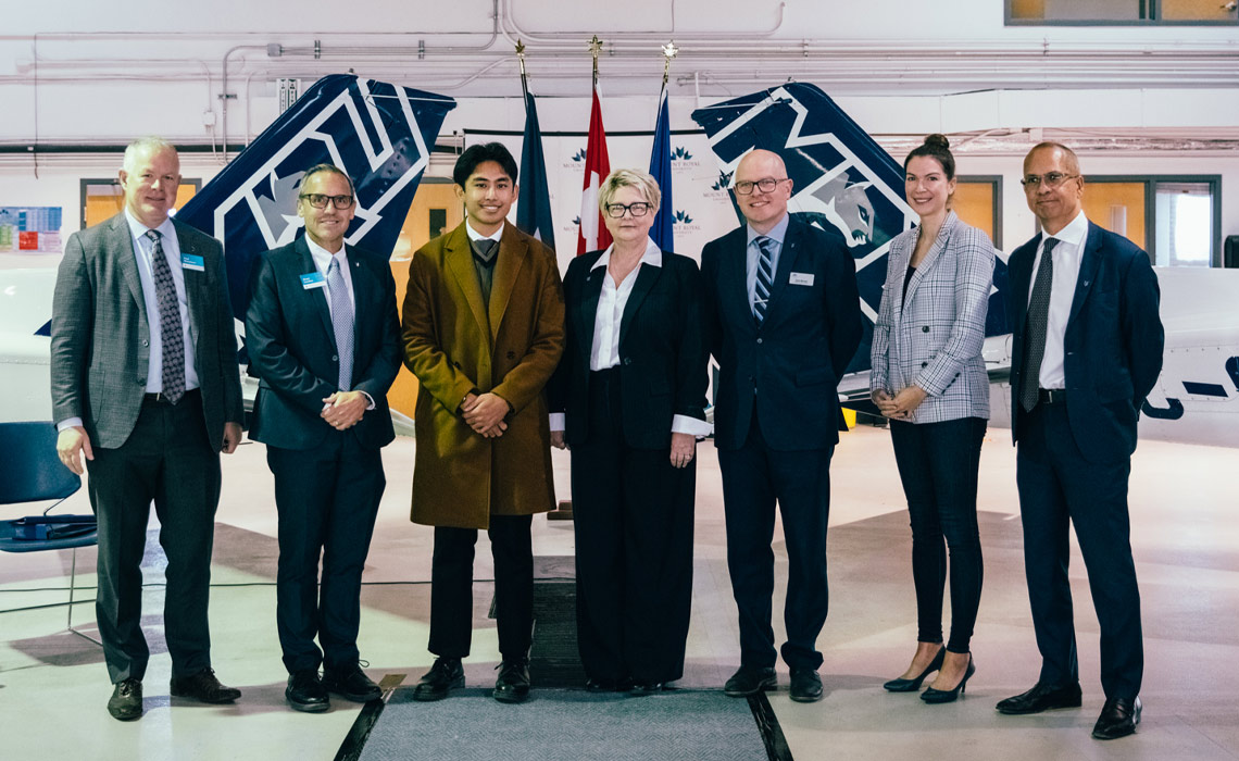 Paul Rossmann, VP University Advancement, MRU; Chad London, provost and VP Academic, Zach Yepes, aviation student; Kelly Williams-Whitt, dean, Faculty of Business and Communications Studies; Dave McLean, director ofmarketing, Shelagh Hayes, director general, Business Innovation and Community Development, PrairiesCan, and Chris Lee, interim chair, MRU Board of Governors.