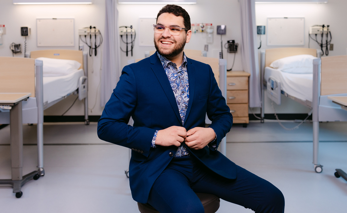 Hamza Echchoujaa poses for a photo in the Mount Royal University nursing lab.