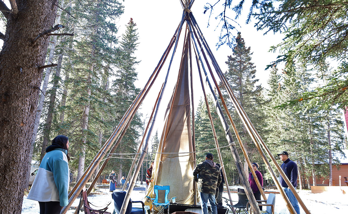 Participants in the Indigenous mentorship program take part in a tipi raising during the Back to the Land Mentee Retreat.
