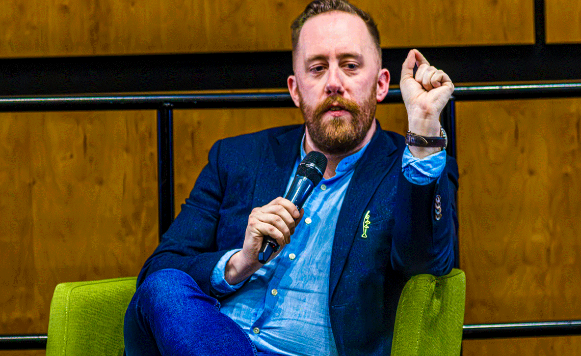 Justin Ling delivering a presentation at Mount Royal University addressing the intersection of trust, truth and misinformation.