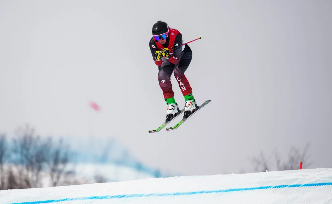 Canadian ski cross athlete Marielle Thompson is captured in mid-air during a jump.