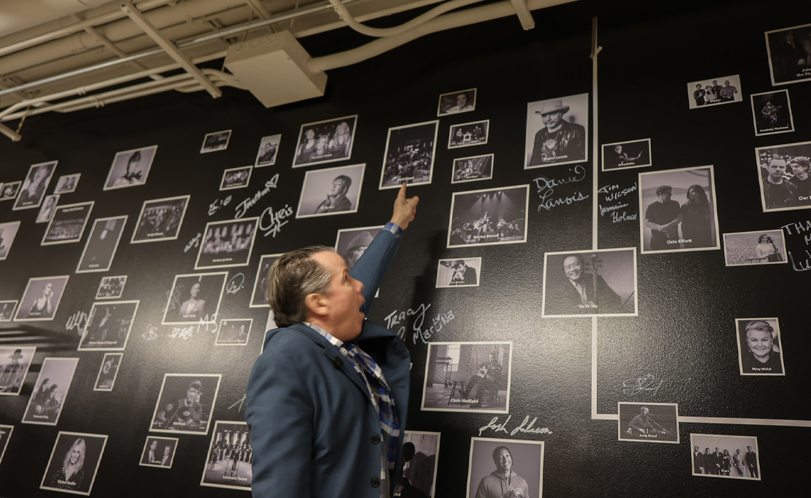 Bruce McCulloch points at his signed portrait.