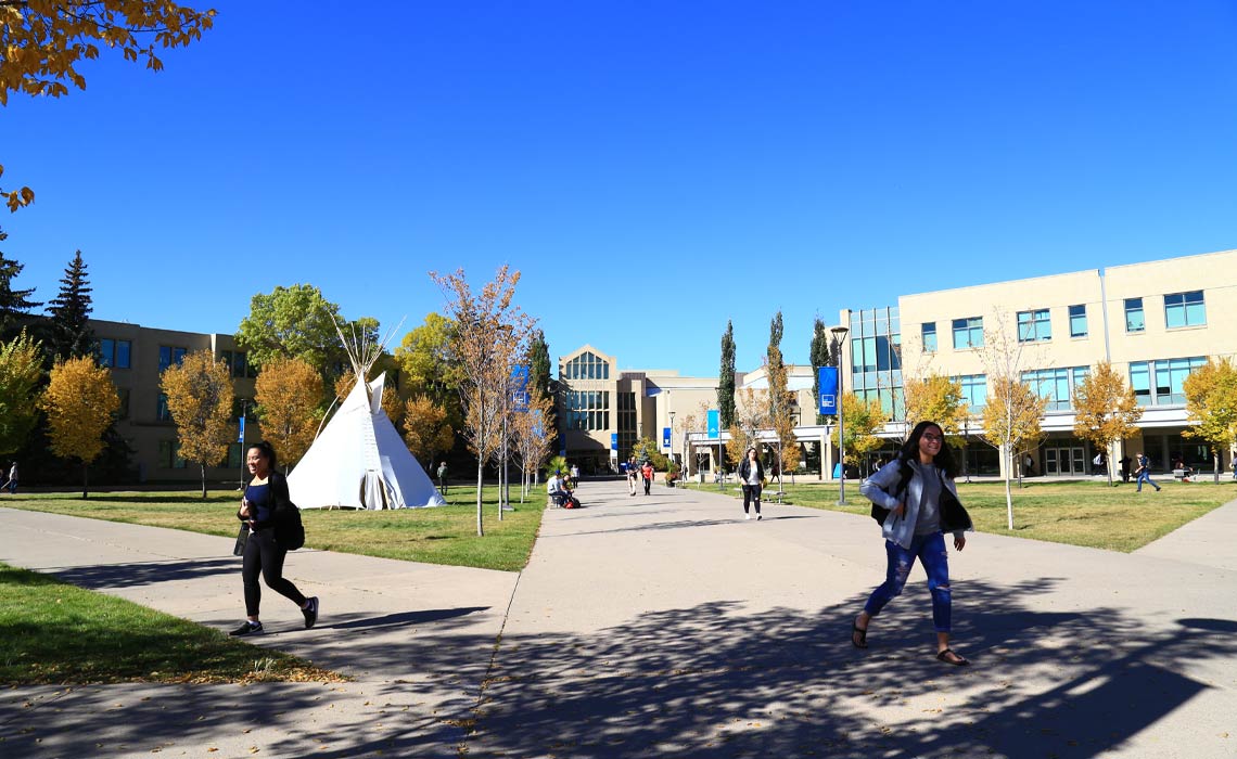 Students walking on MRU's campus.