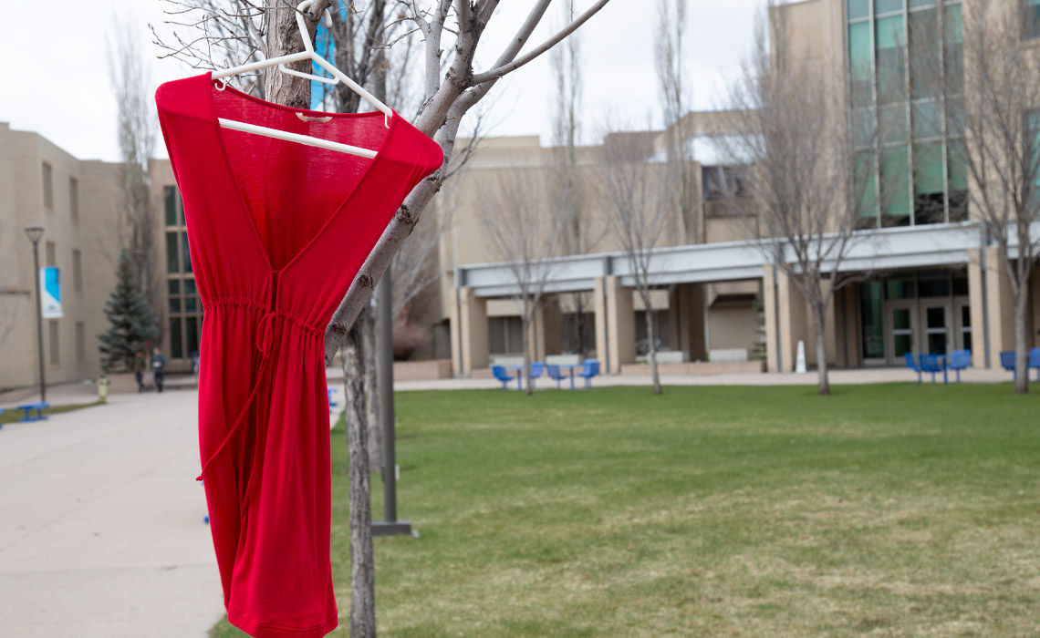 A red dress on display at Mount Royal University.