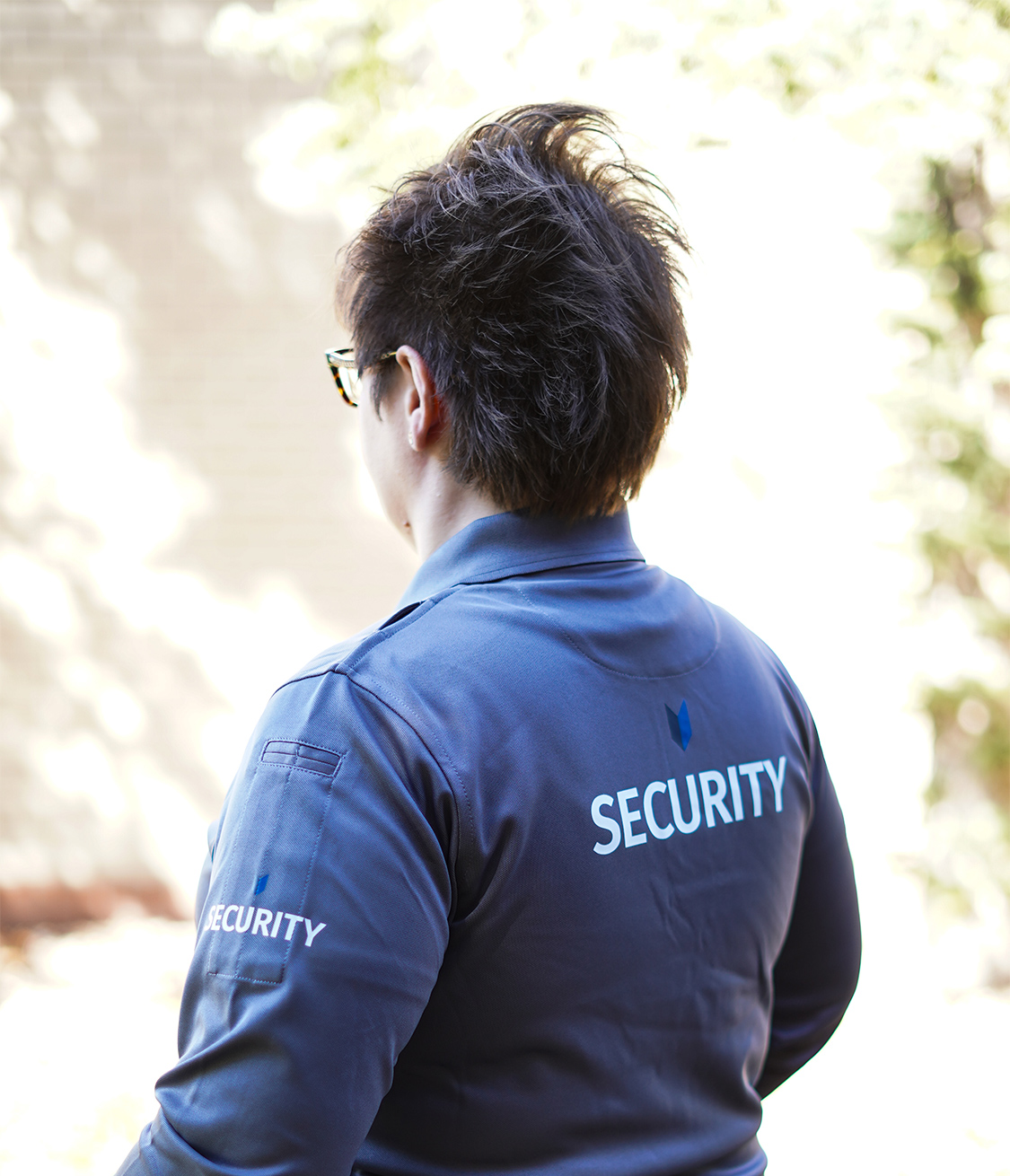 Team uniforms with grey shirts and two-tone jackets, blue exterior with grey interior, designed for visibility and approachability.