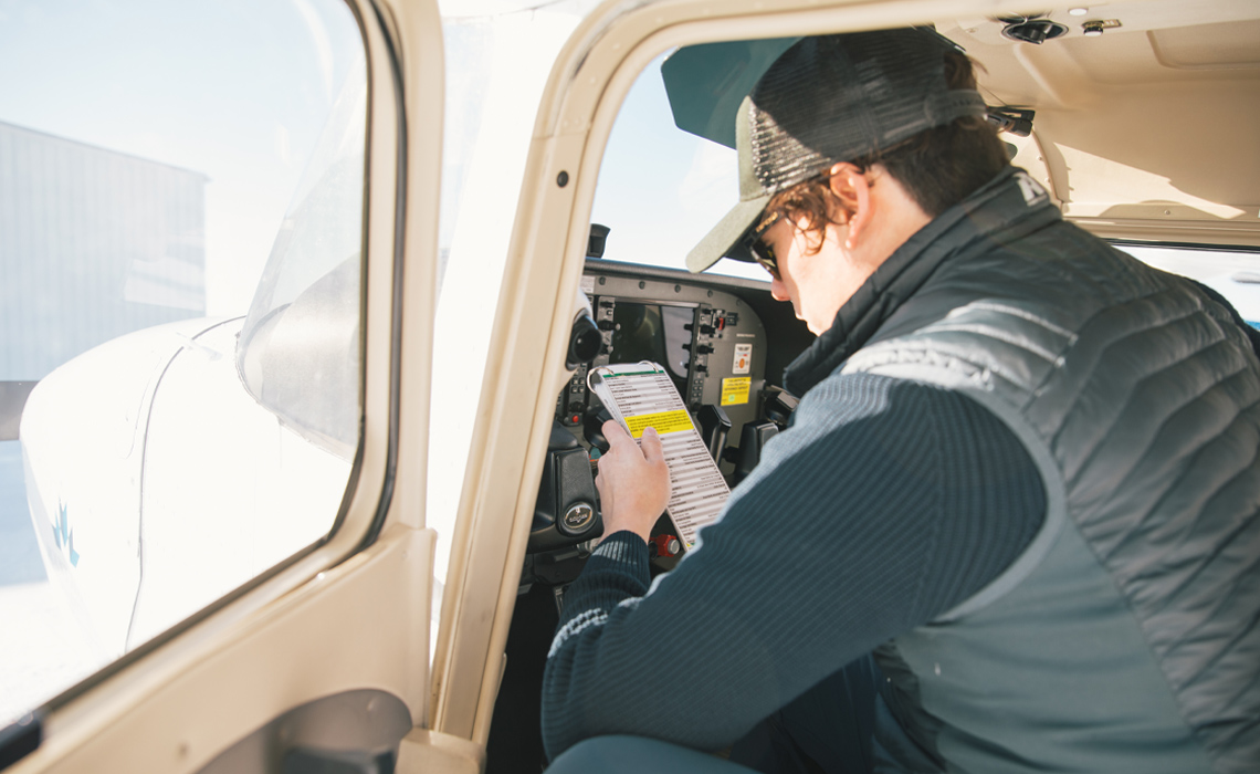 Nichol reviewing the pre-flight checklist.