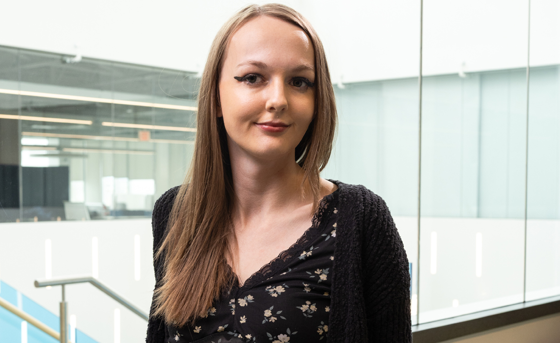 Stacey Alexander poses for a photo in the Riddell Library & Learning Centre.