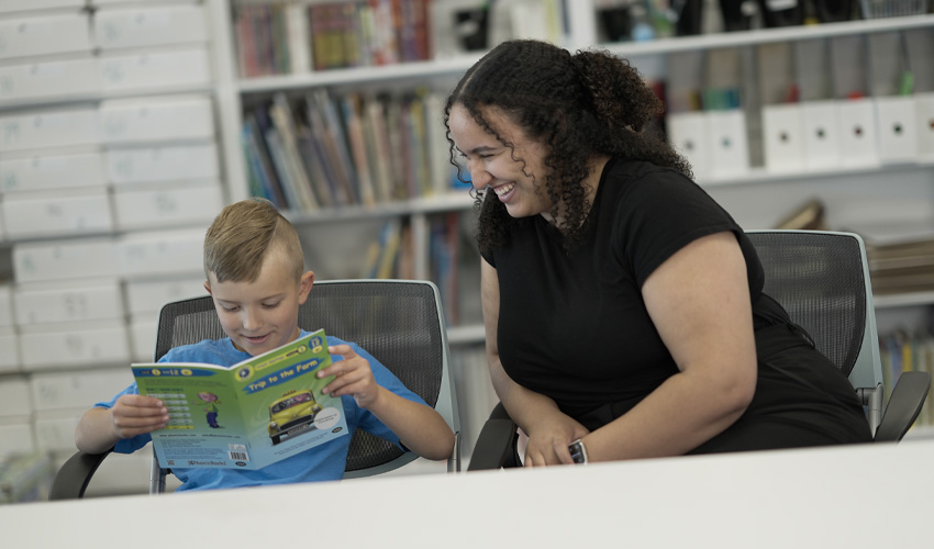 A student reading to a tutor.