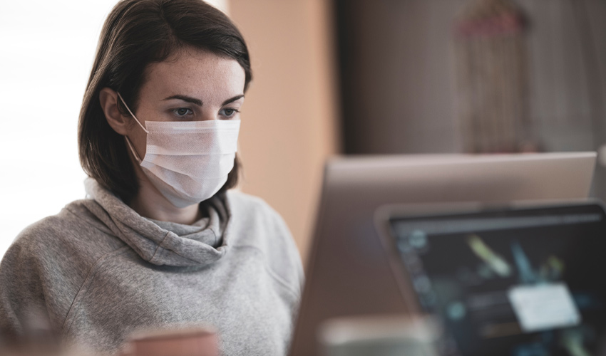 A woman working from her home during the COVID-19 pandemic.