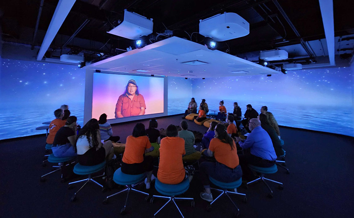 Projection of Belly Buttes video at Mount Royal's Immersion Studio, with water and a night sea projected in 360 on the walls.