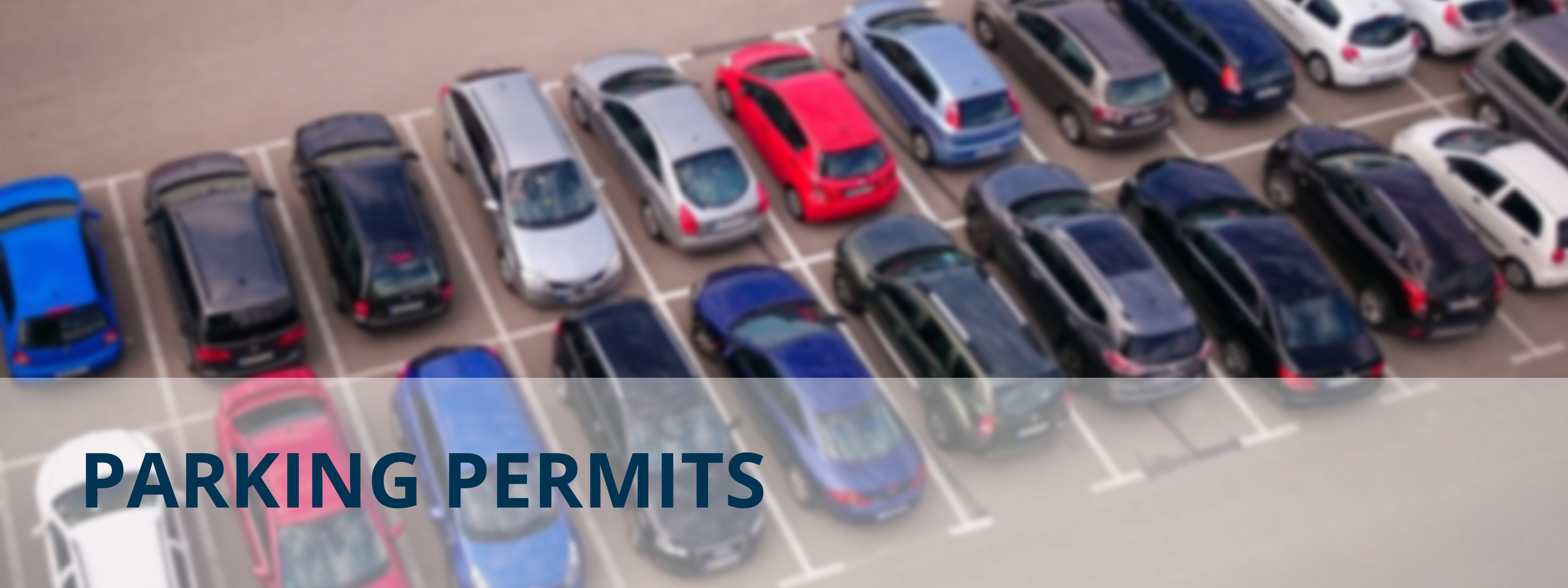 An image of cars in a parking lot overlayed with the text "Parking Permits"