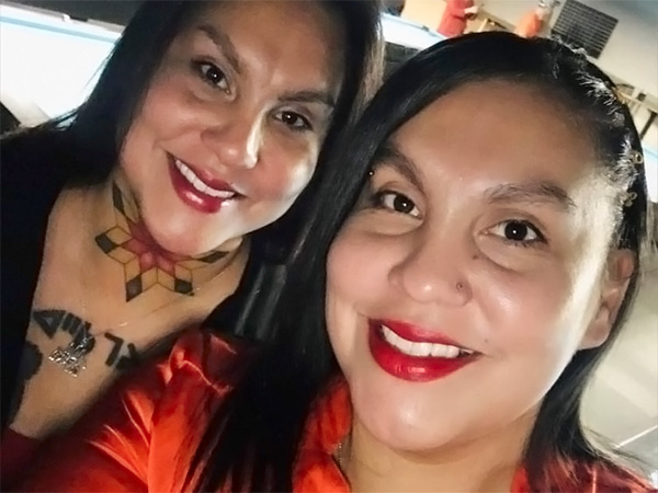 Selfie of Jody and Judy Bear, leaning into one another.