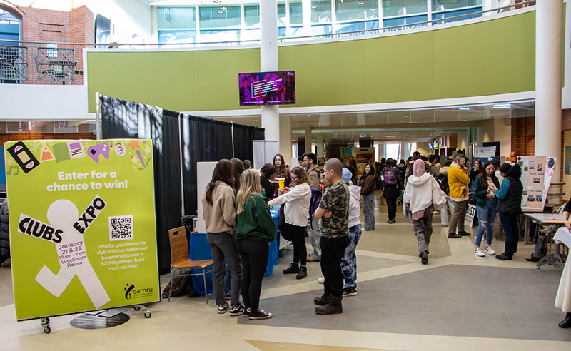 Students visits club booths at Clubs Expo in the Wyckham House Student Centre.