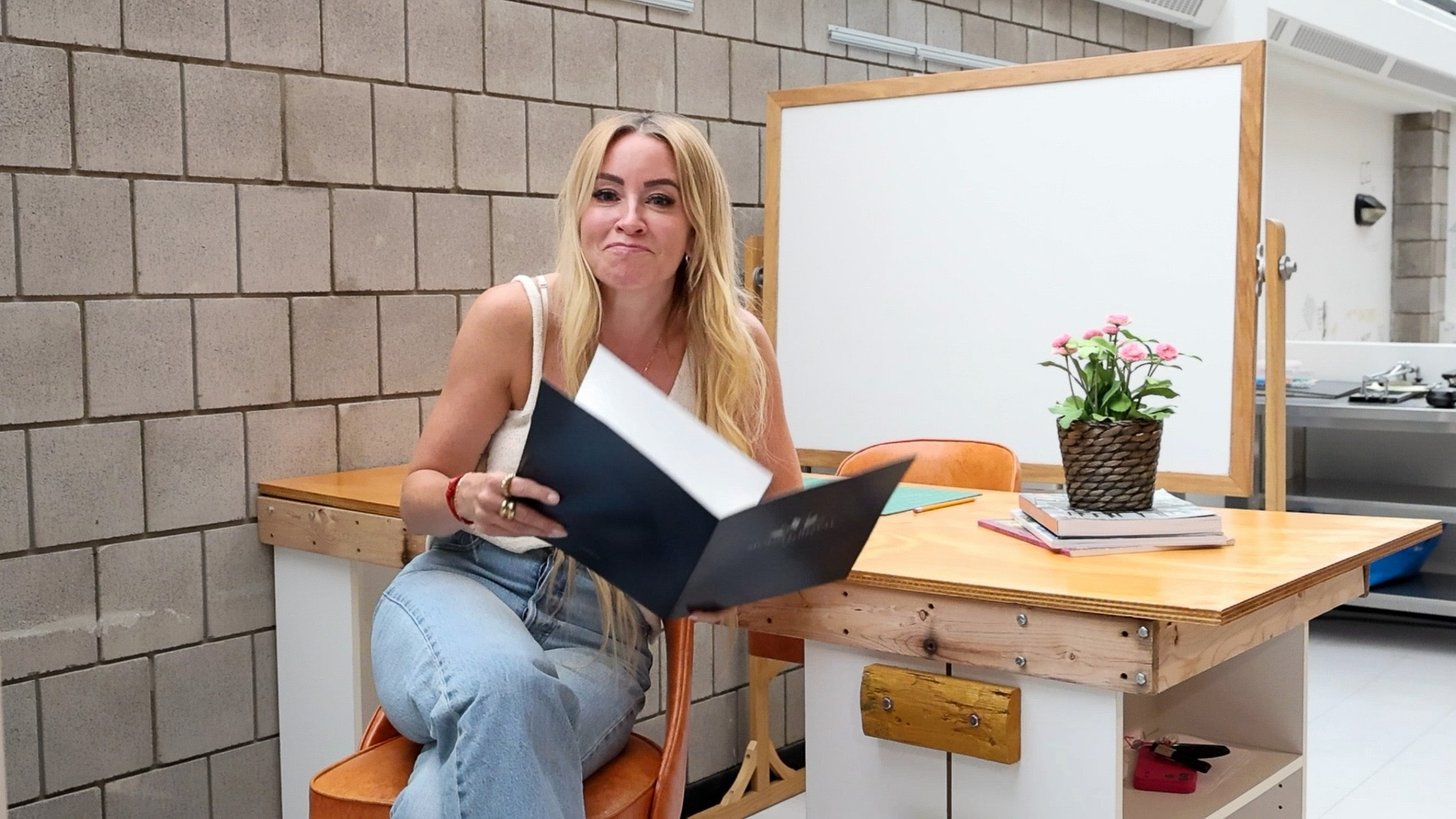 Amanda Hamilton reads a letter from a scholarship recipient