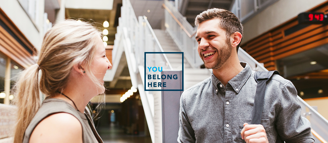 Two people having a conversation in Mount Royal University's Roderick Mah Centre for Continuous Learning