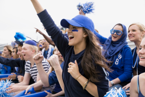 The stands of cheering fans at a Cougar's game.