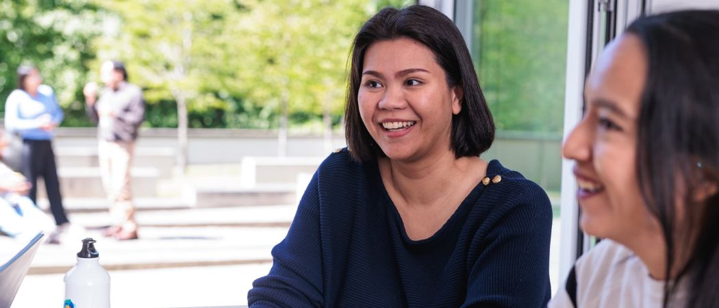 Two mature students work together