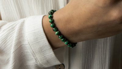 A green beaded bracelet from Alora Boutique
