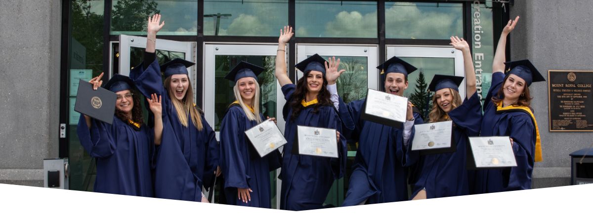 A group of new grads taking a celebratory photo outside of MRU recreation