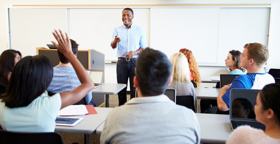 An instructor teaching a class of adult learners.