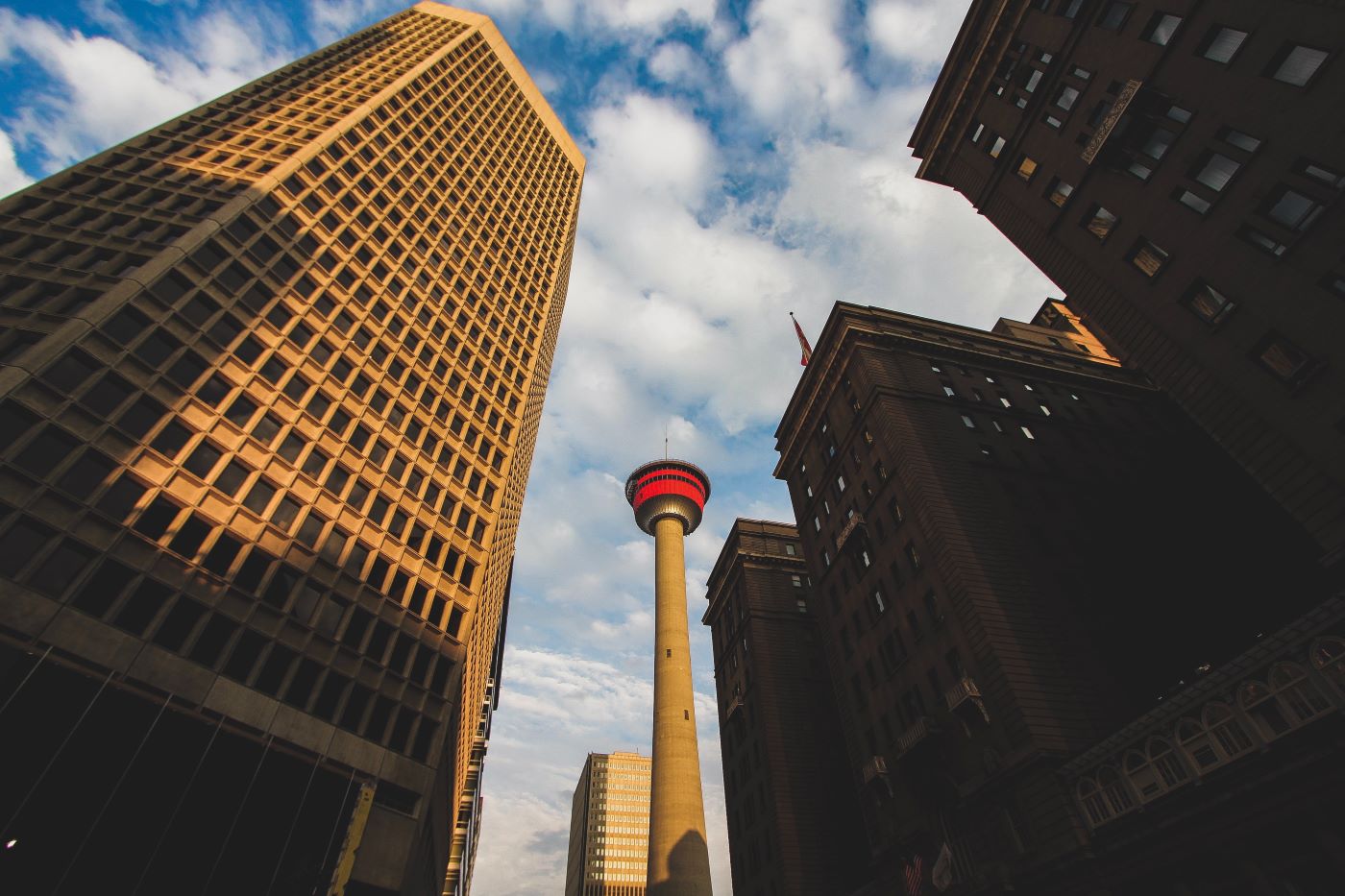 Calgary Tower and surrounding buildings shot from below.
