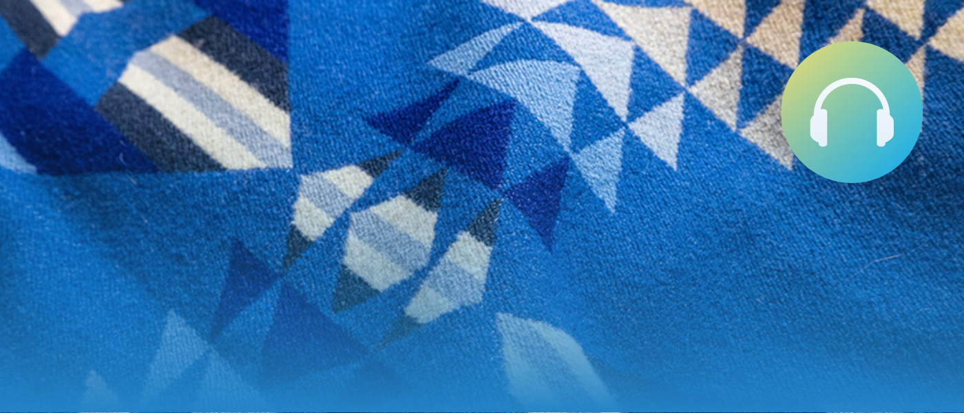 Blanket from the Iniskim Centre. A geometric pattern made out of many triangles.