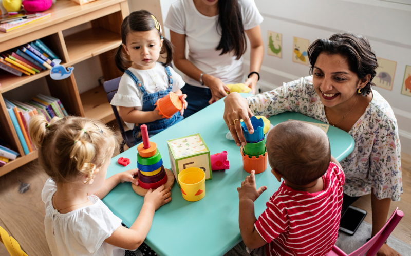 An early childhood educator with children