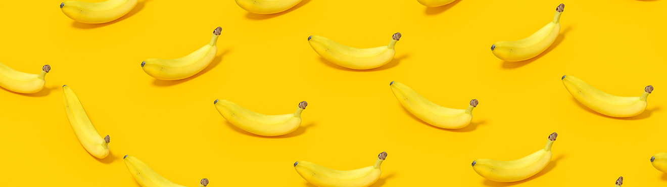 A pattern of bananas on a yellow background.