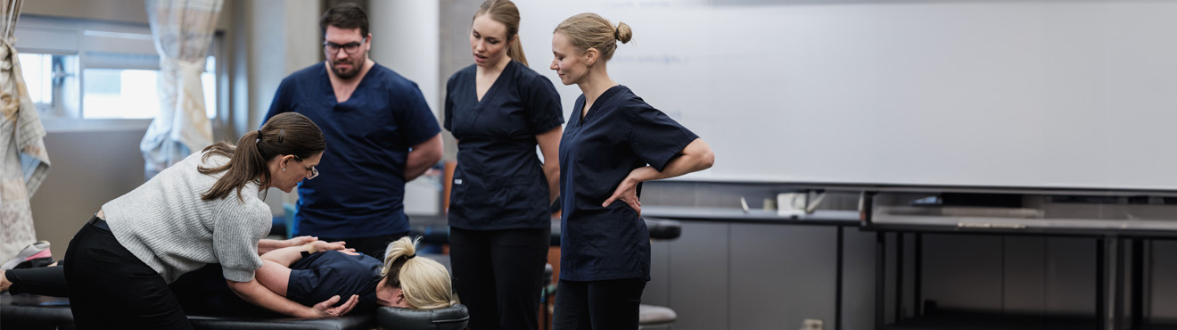 A group of Mount Royal massage therapy students performing massages as part of their hands-on training.