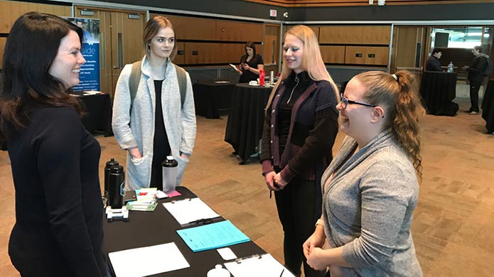 Personal Fitness Trainer Diploma students, speak with Jodie Boettger, a talent acquisition specialist with World Health/Spa Lady/Bankers Hall Club, at the recent career fair held in Ross Glen Hall.