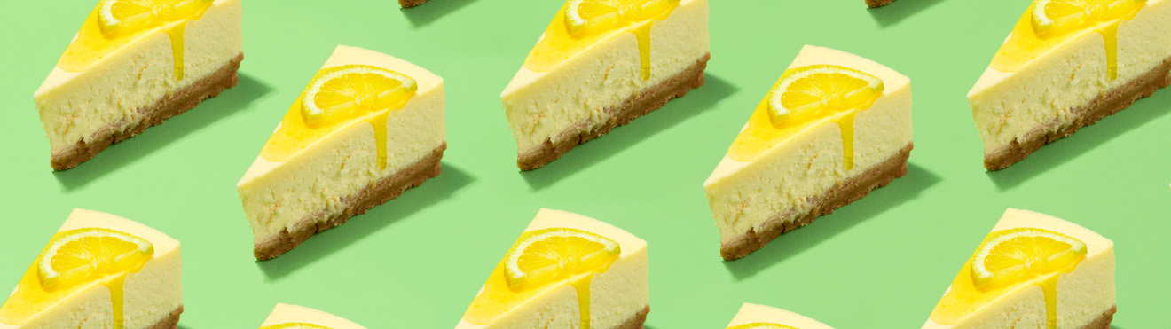Slices of cheesecake in a pattern on a bright green background.