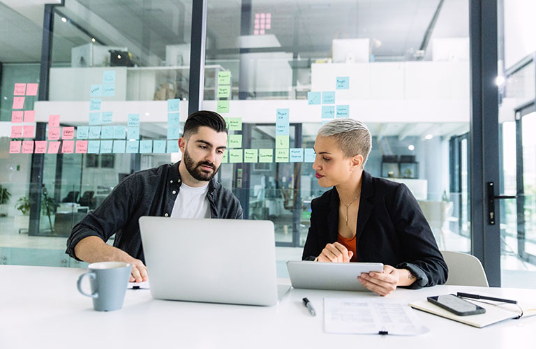 Two professionals discuss a business contract.