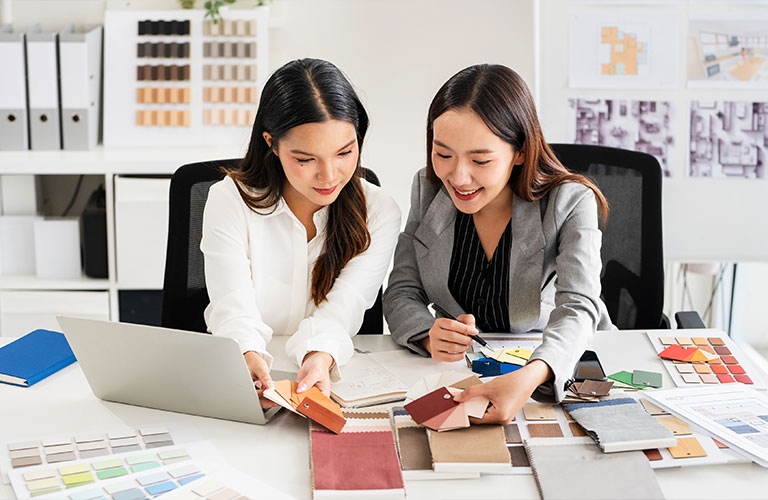 Interior decorator reviewing colour swatches in an office