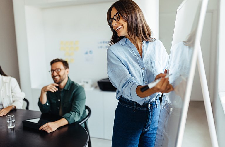 Business woman presenting her ideas to her team during a meeting.