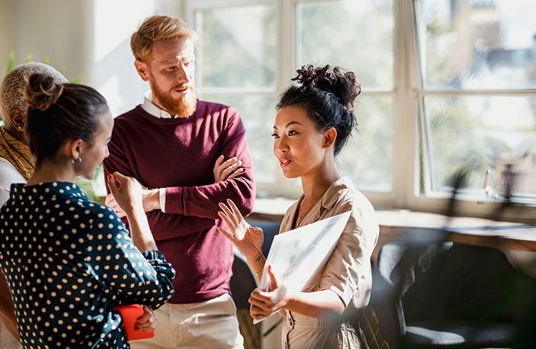 A diverse group of professionals having a discussion.