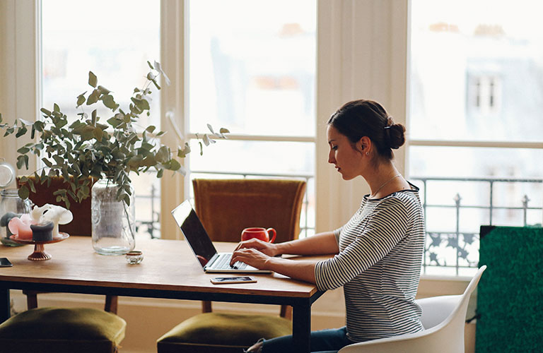 A woman working at a desk.