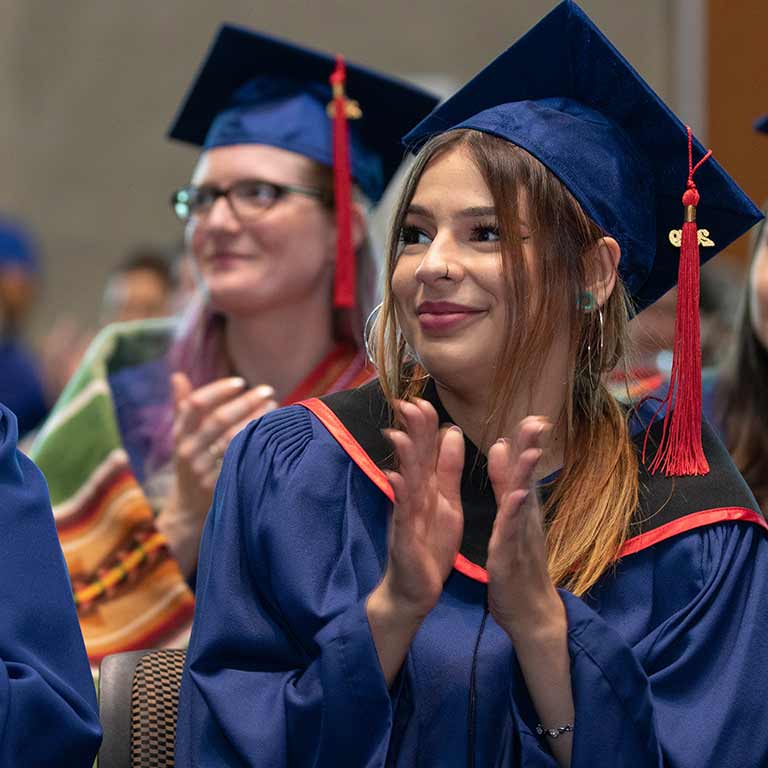 Photo of students applauding at Indigenous Graduation