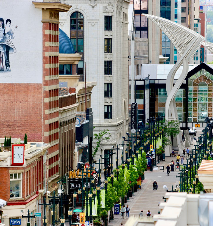 Calgary's Stephen Avenue — a pedestrian street in the heard of downtown between brick and modern buildings.