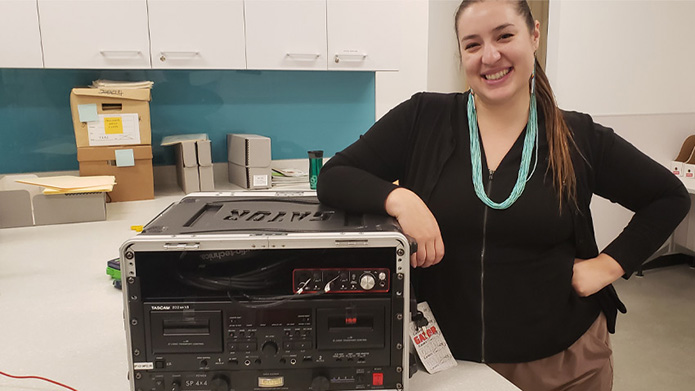 Anthropology and Indigenous studies liaison librarian Jessie Loyer poses with a digitization kit.