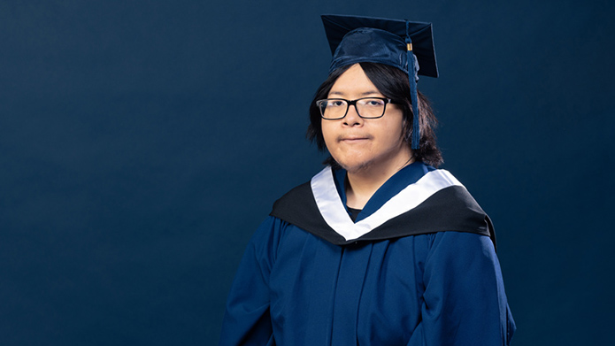 Spirit River Striped Wolf in MRU graduation regalia.