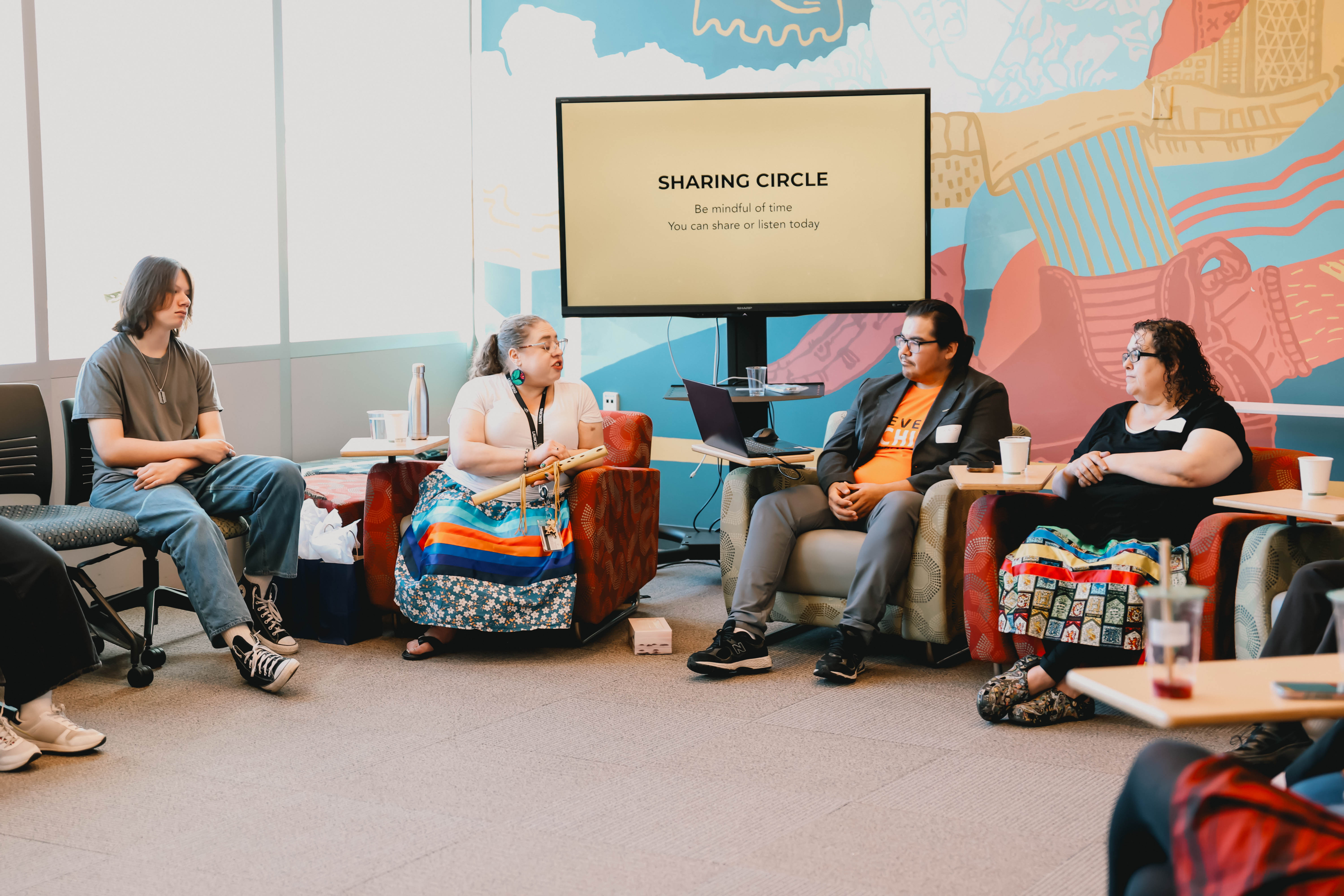 Group of people in a sharing circle